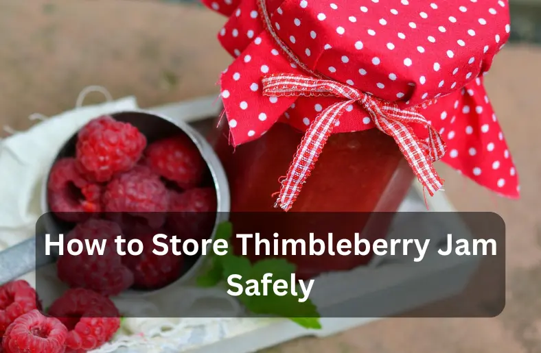 Jar of thimbleberry jam with fabric cover showing safe homemade jam storage